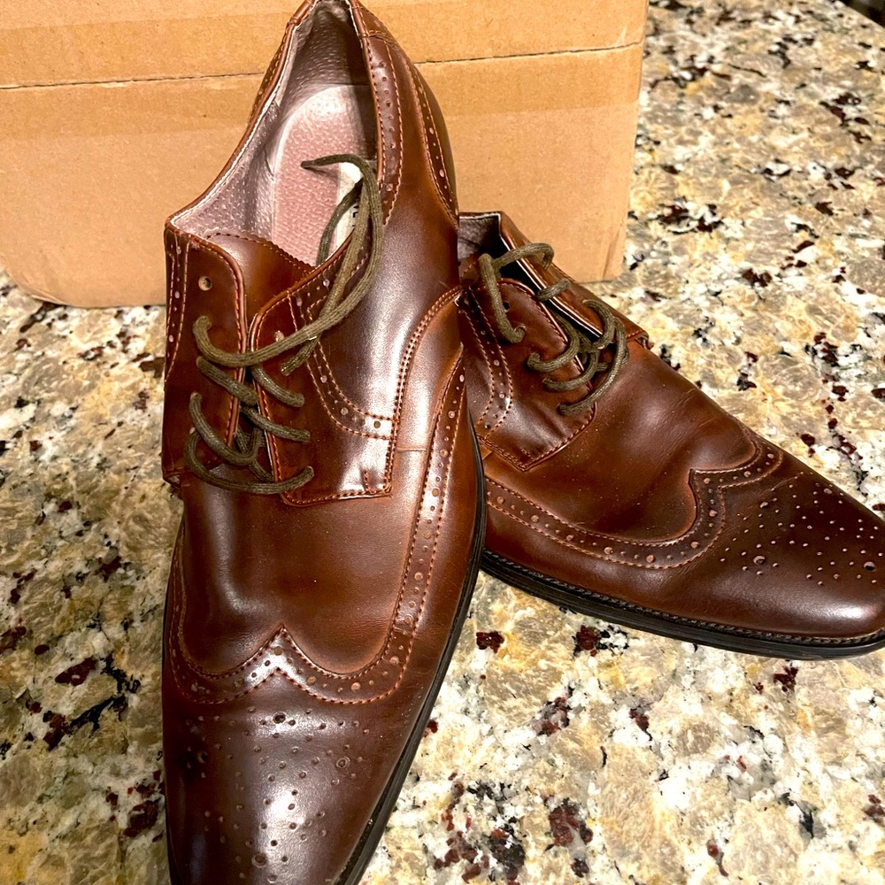Brown wing tip dress shoes